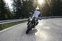 Yamaha Tracer 9 GT+ riding on country road