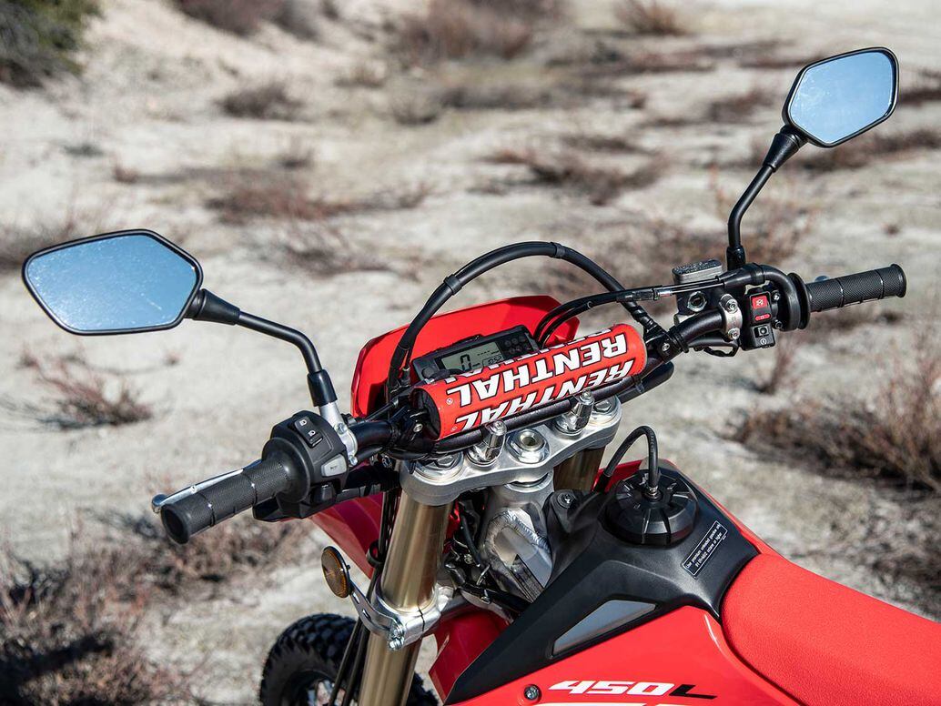 Cockpit view is reassuringly stripped down and simple, with the Renthal bar padded for good measure.