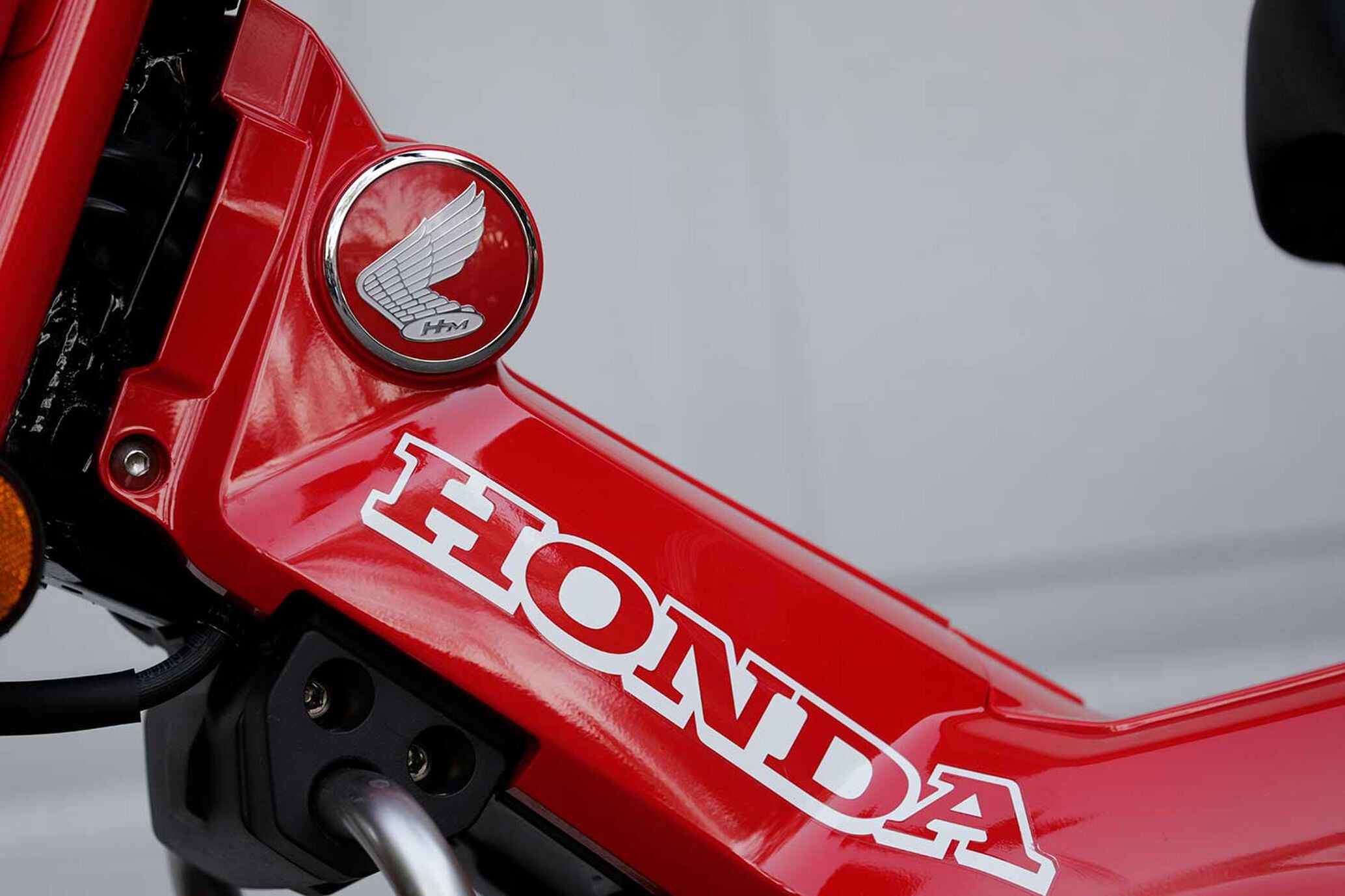 Subtle styling touches like this 3D Honda wing logo make the Trail 125 feel more expensive than its $3,899 asking price.