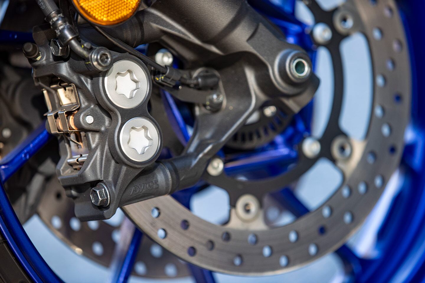 The 2024 Yamaha YZF-R7 features radial-mount, four-piston brake calipers clamping down on massive 298mm discs for unparalleled stopping power.