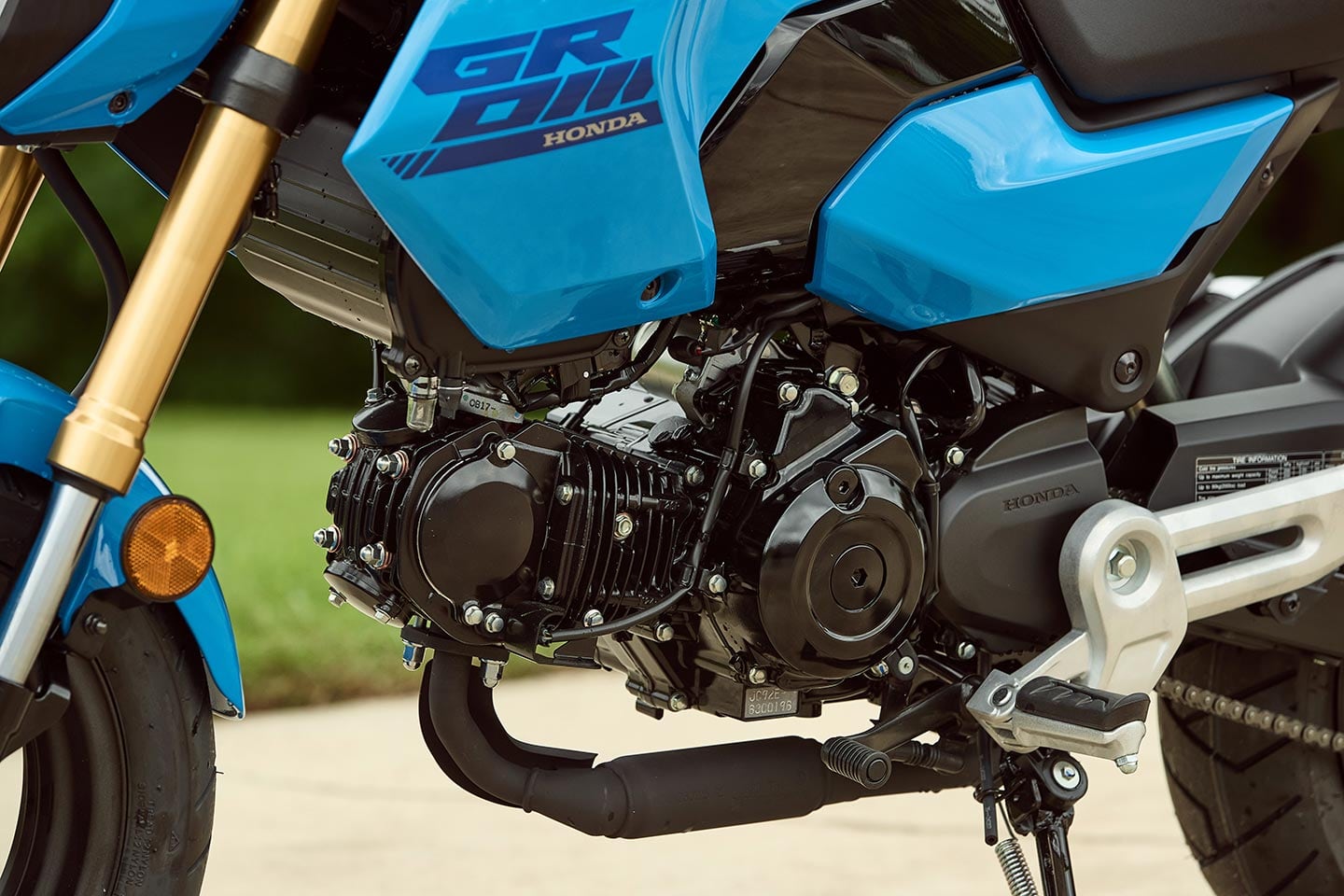 The 2025 Honda Grom boasts a reliable 124cc air-cooled single-cylinder powerplant.