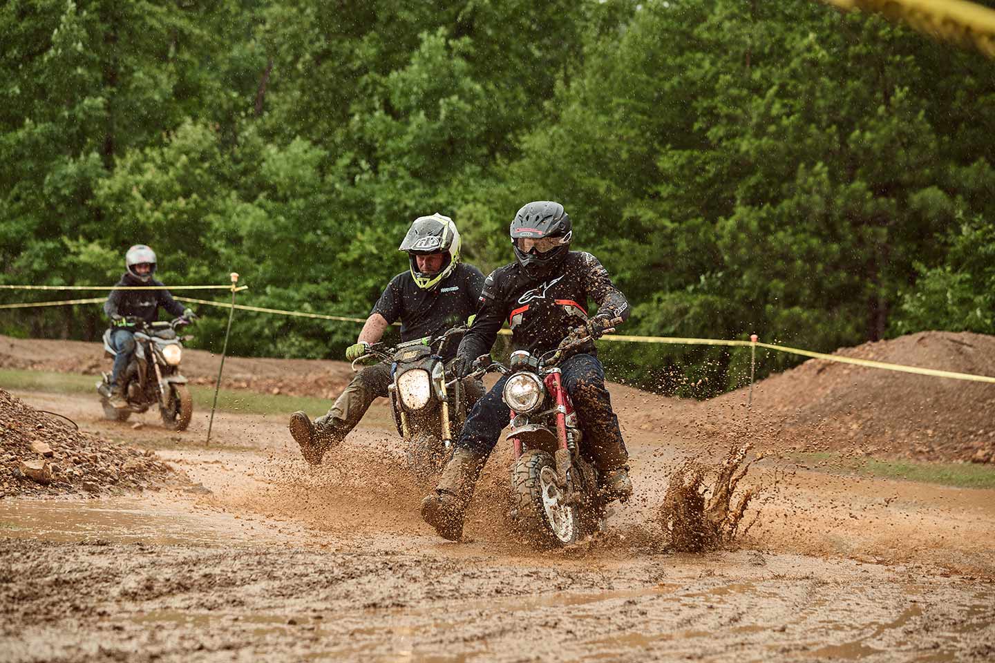 It was a mudder! Two racers battle for position during the pitbike race.