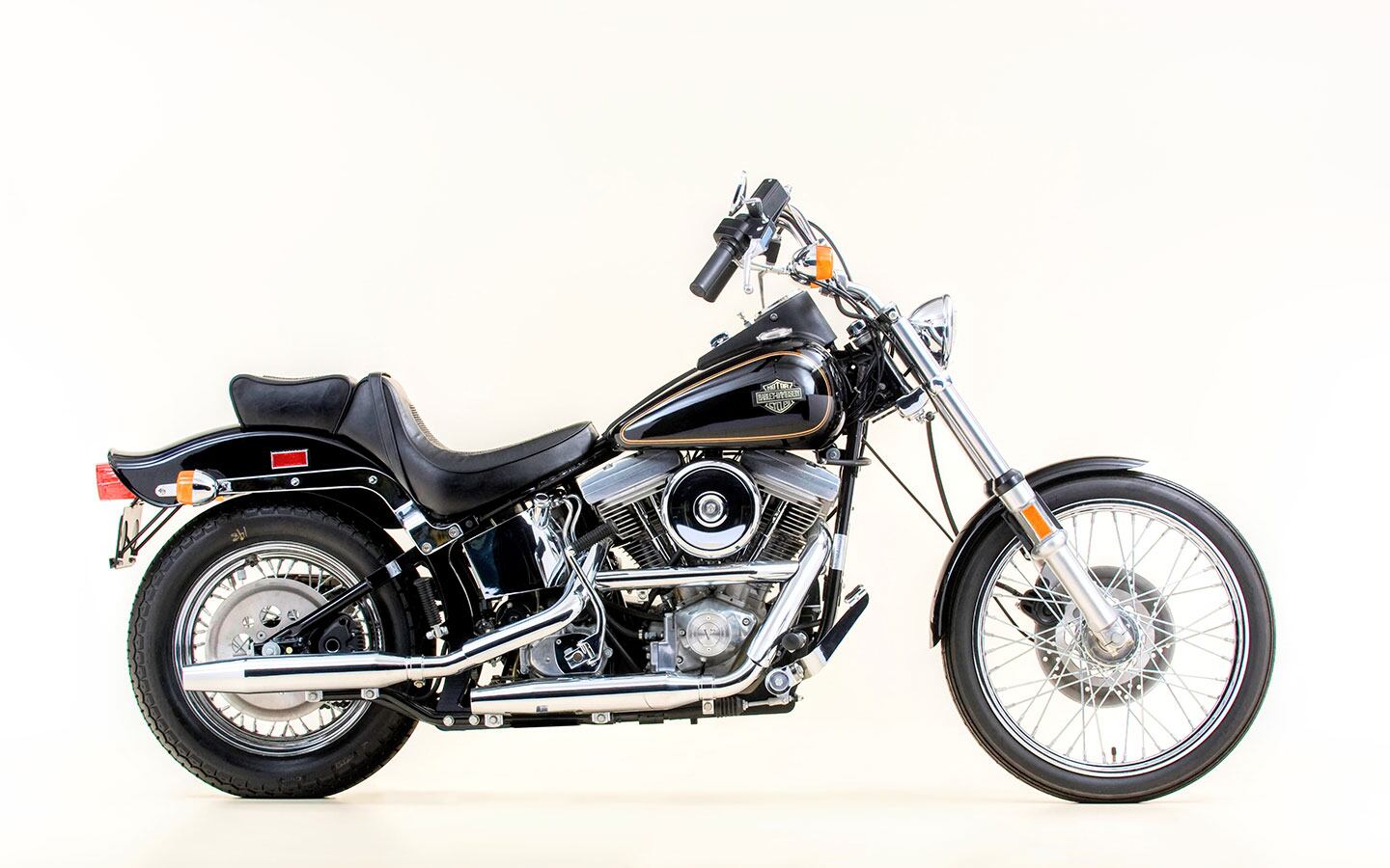 The 1984 Harley-Davidson FXST Softail. Forward controls, pulled-back bars, and hardtail lines. You got a lot to like right off the shelf.