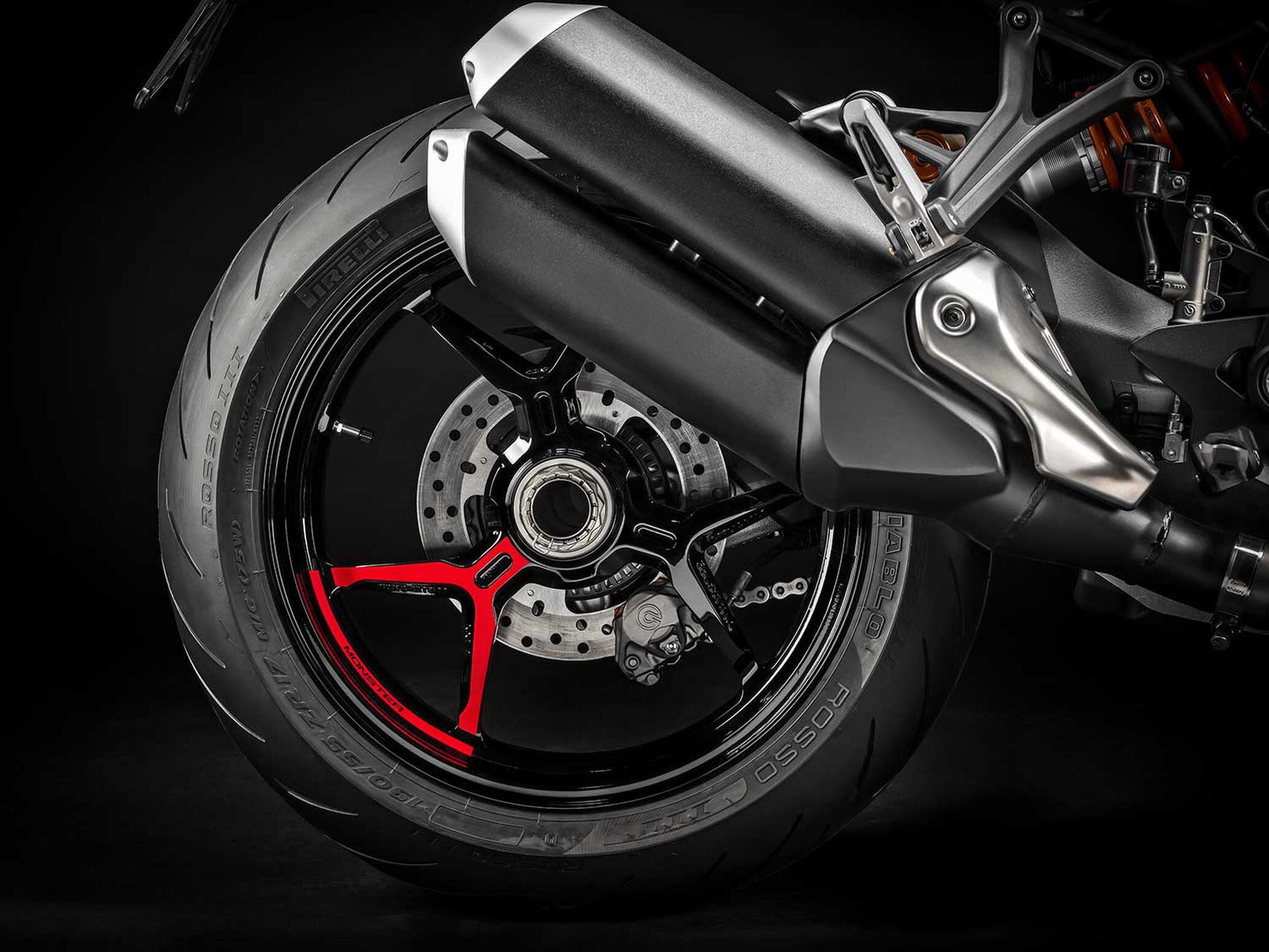 The Monster 1200 S adds Y-spoke alloy wheels versus the standard model's 10-spoke rims.